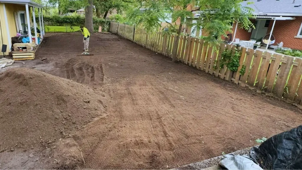 Grading and base preparation of a lawn prior to sod installation